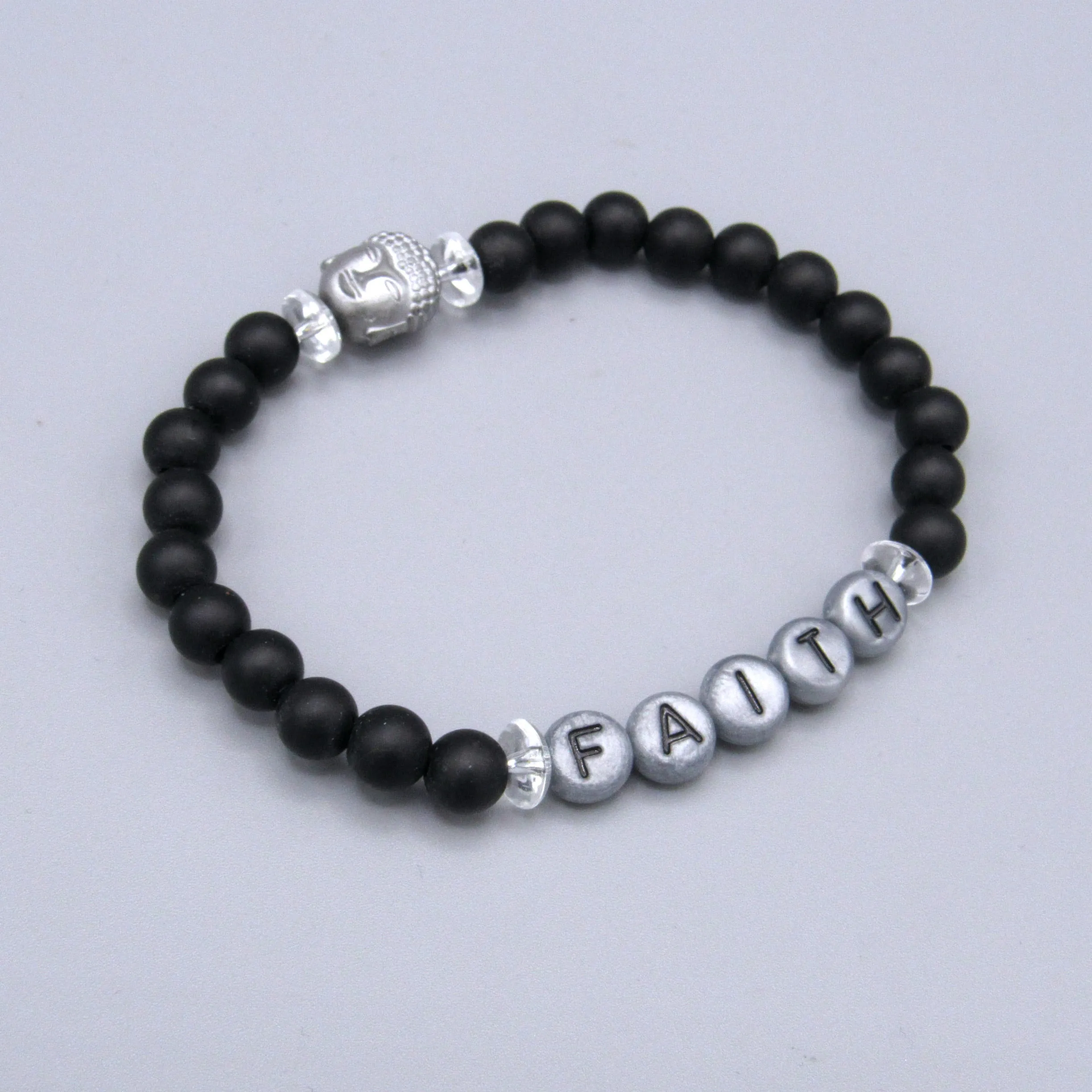 Matte Onyx, Hematite Gemstone Buddha, and Clear Quartz “FAITH” Stretch Bracelet