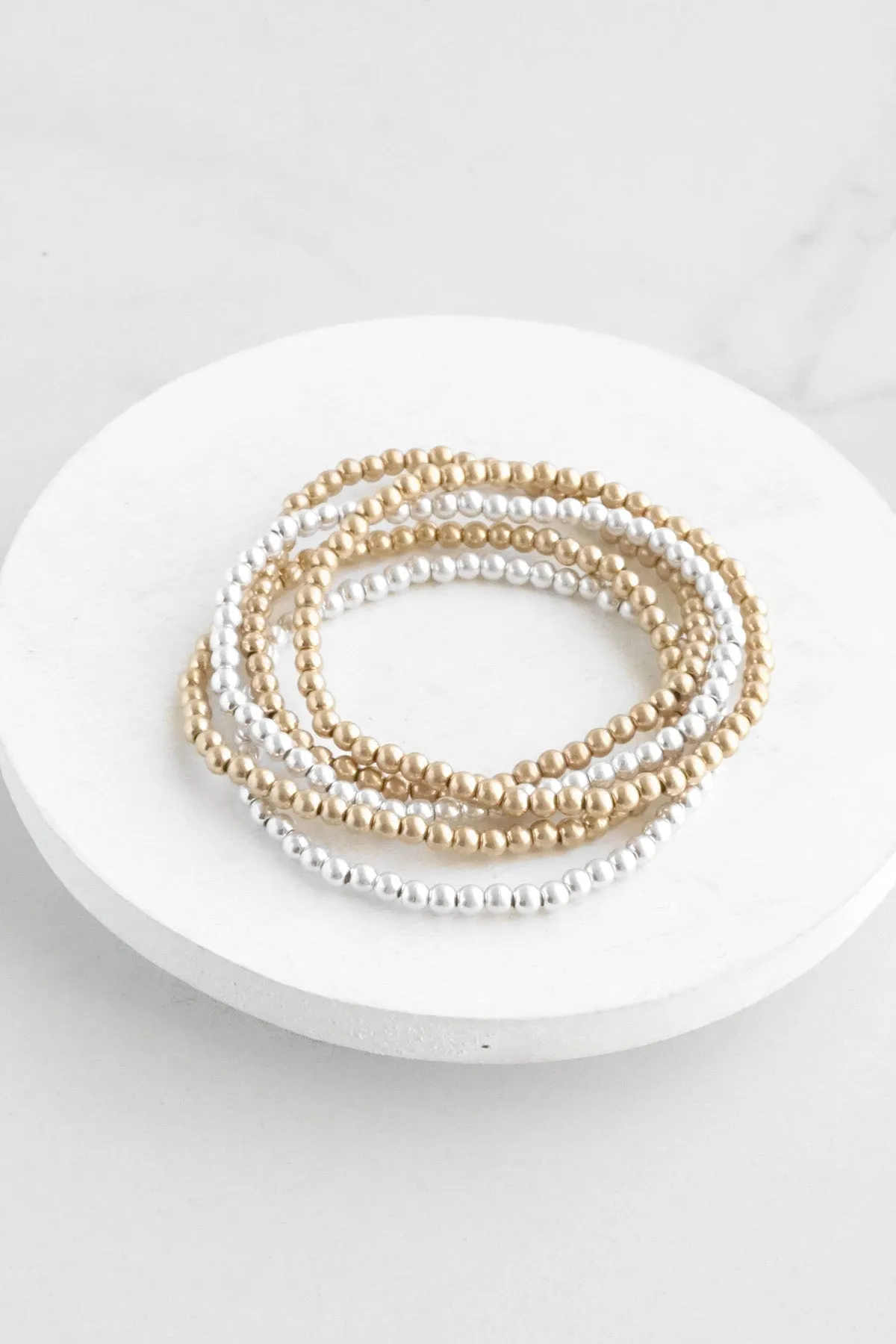 Worn Gold and Silver tone small beaded bracelet stack of 5 bracelets