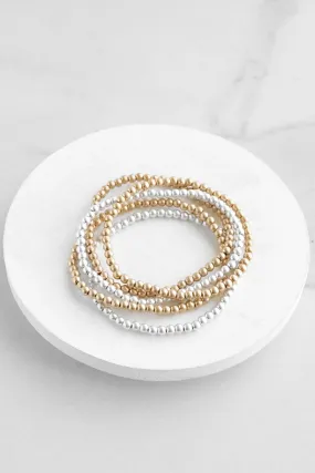 Worn Gold and Silver tone small beaded bracelet stack of 5 bracelets